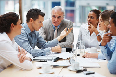 A Group of People Sitting Around a Table